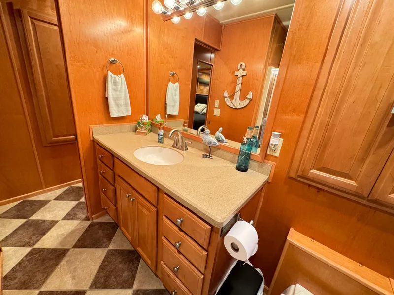 Slide: The Image of Luxurious Sumerset 20x100 houseboat bathroom with wood cabinetry and nautical decor, 2004 model. - 39
