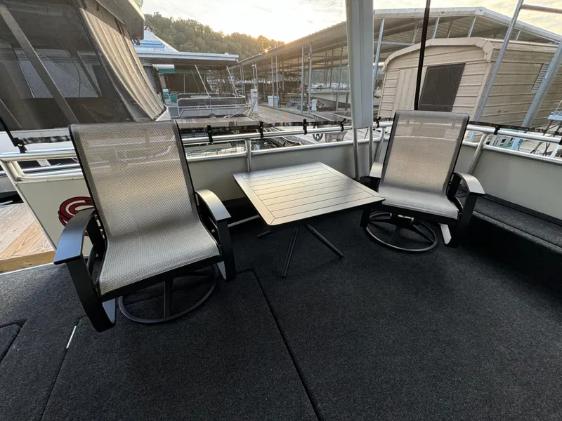 Slide: The Image of Two chairs and a table on a 2004 Sumerset 20x100 houseboat deck. - 6