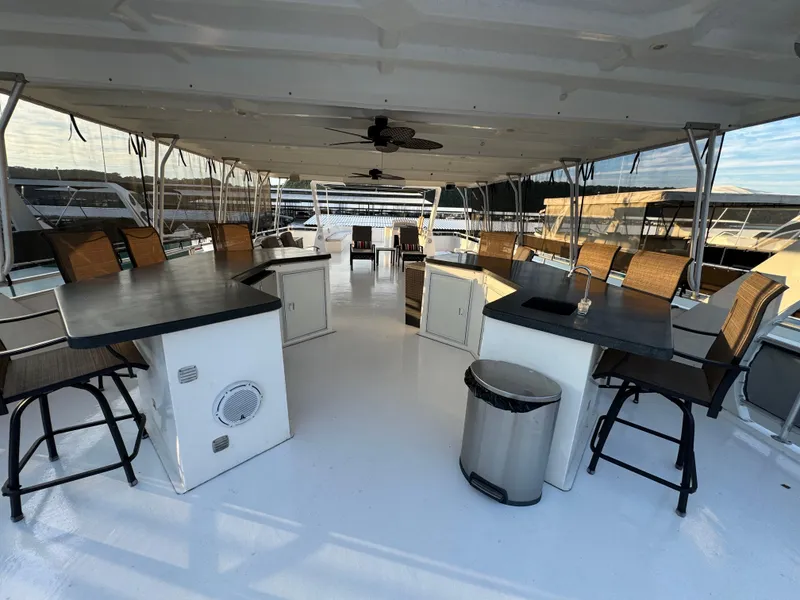 Slide: The Image of Spacious 2004 Sumerset 20x100 houseboat deck with seating and tables. - 8