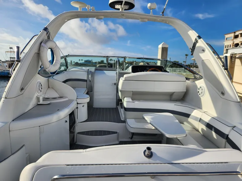Slide: The Image of 2002 Formula 37 PC yacht interior with white seating and modern amenities. - 10