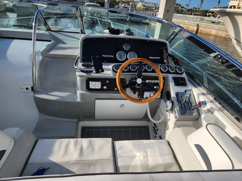Slide: The Image of 2002 Formula 37 PC yacht cockpit with steering wheel and control panel. - 16