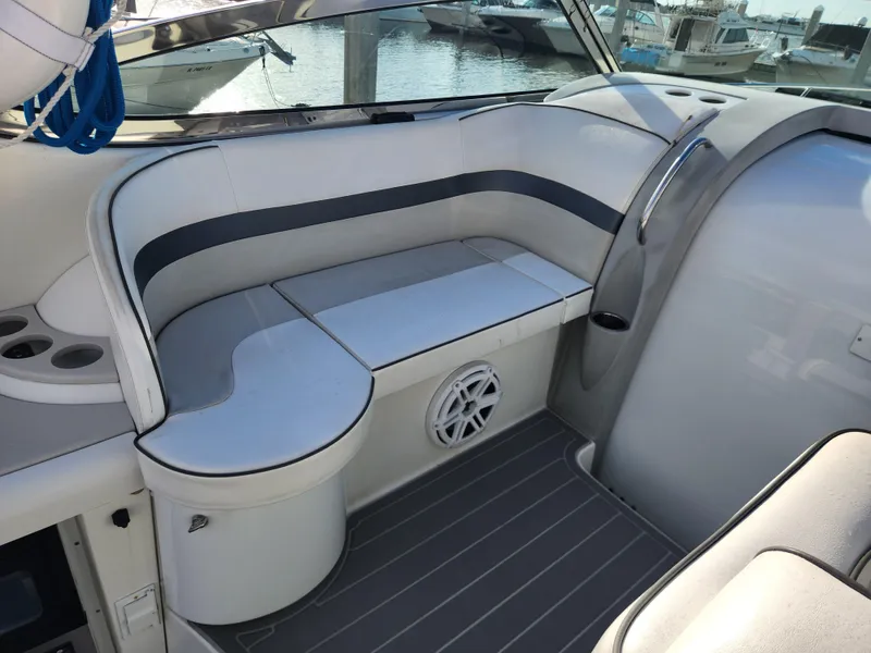 Slide: The Image of 2002 Formula 37 PC boat interior with cushioned seating and speaker. - 18