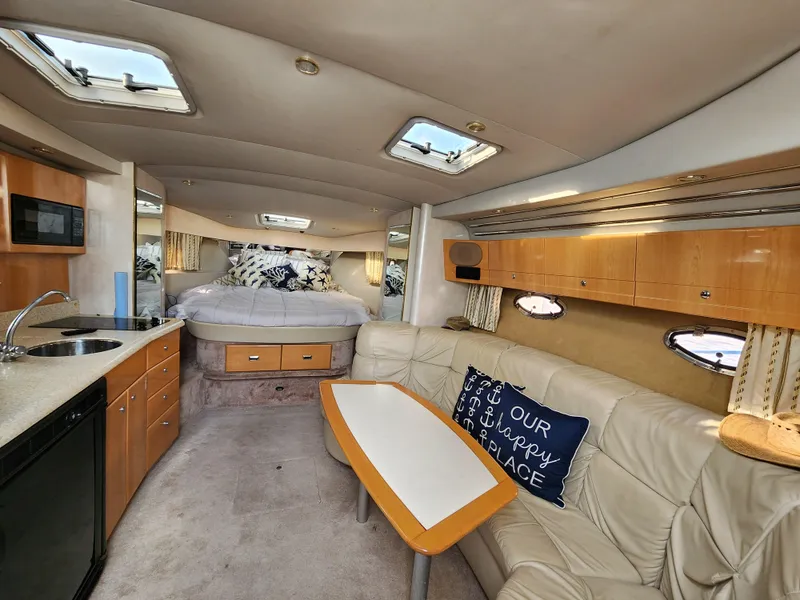 Slide: The Image of Interior of a 2002 Formula 37 PC yacht with modern amenities and cozy seating. - 19