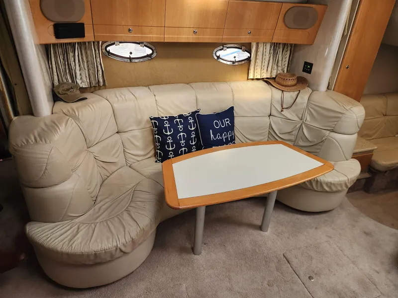 Slide: The Image of 2002 Formula 37 PC yacht interior with beige leather seating and decorative pillows. - 22