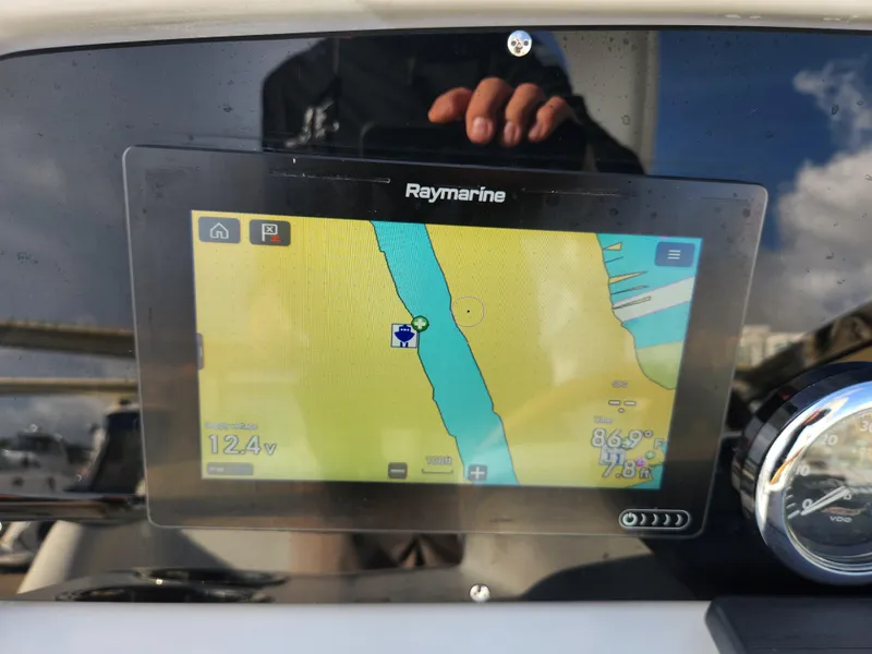 Slide: The Image of Raymarine navigation display on a 2002 Formula 37 PC boat dashboard. - 27