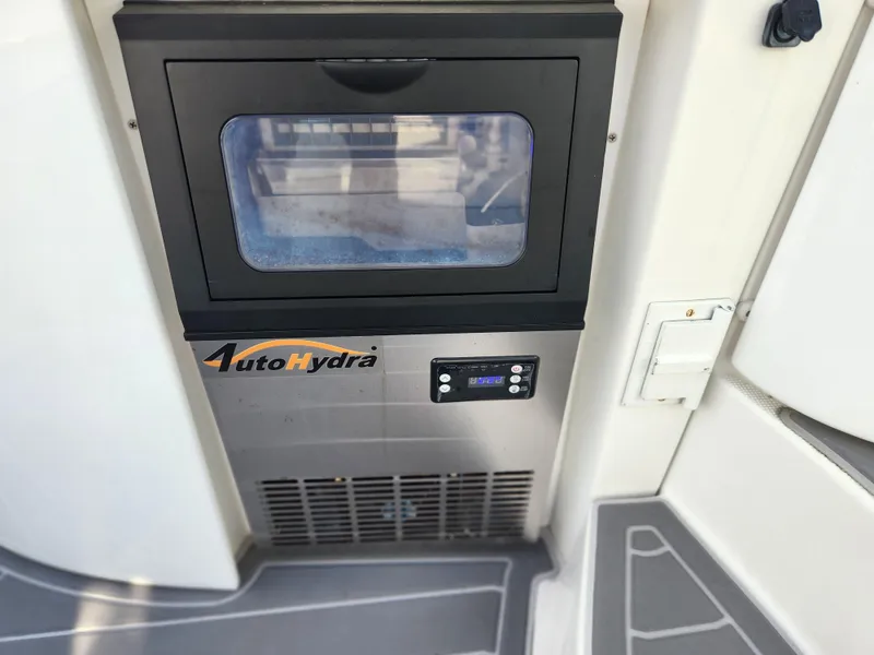 Slide: The Image of AutoHydra ice maker on 2002 Formula 37 PC boat, featuring digital controls. - 28