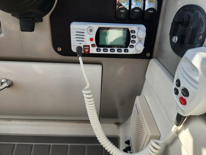 Slide: The Image of 2002 Formula 37 PC boat dashboard with radio and controls. - 29