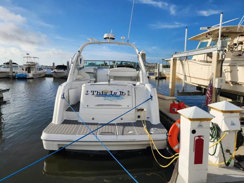 Slide: The Image of 2002 Formula 37 PC yacht docked at marina, rear view with clear sky. - 3
