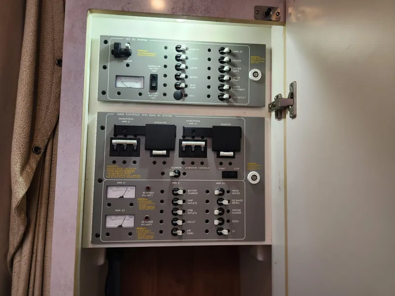 Slide: The Image of Control panel inside a 2002 Formula 37 PC boat, featuring switches and gauges. - 30