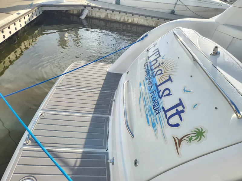 Slide: The Image of 2002 Formula 37 PC boat docked, featuring "This Is It" name on the stern. - 5