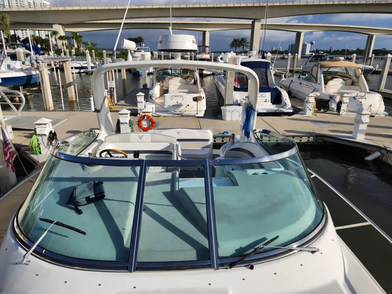 Slide: The Image of 2002 Formula 37 PC yacht docked at marina with bridge in background. - 9