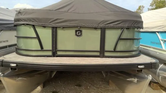 Slide: The Image of Interior seating of 2025 Godfrey Pontoons Sweetwater 2086 CSE, featuring beige upholstery. - 2