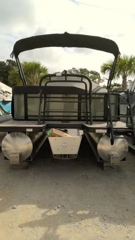 Slide: The Image of 2025 Godfrey Pontoons Sweetwater 2086 CSE, rear view, parked on gravel, with canopy. - 6