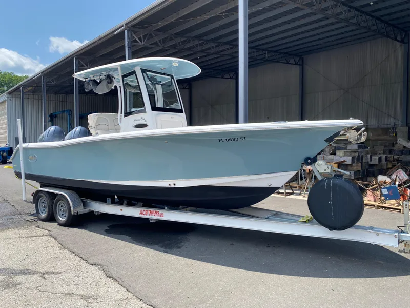 Slide: The Image of 2020 Sea Hunt Gamefish 25 boat on trailer in storage facility. - 0