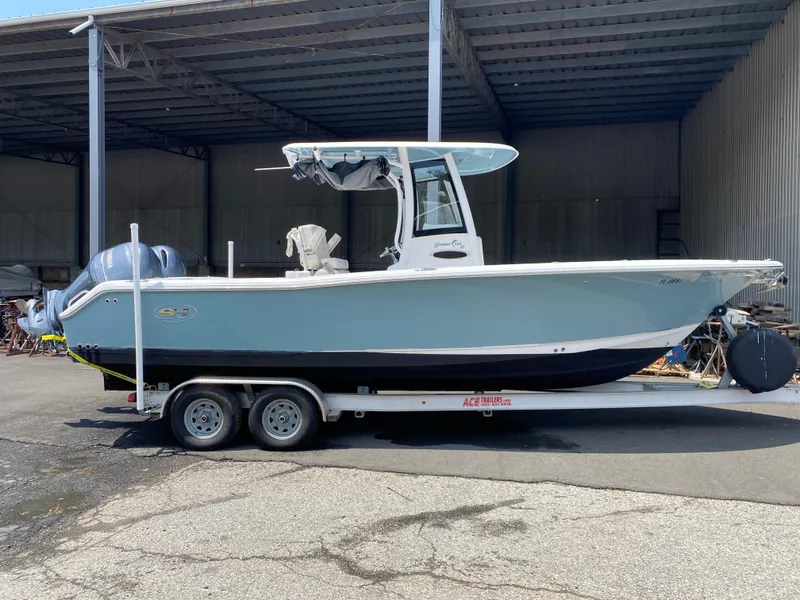 Slide: The Image of 2020 Sea Hunt Gamefish 25 boat on trailer in covered storage area. - 1
