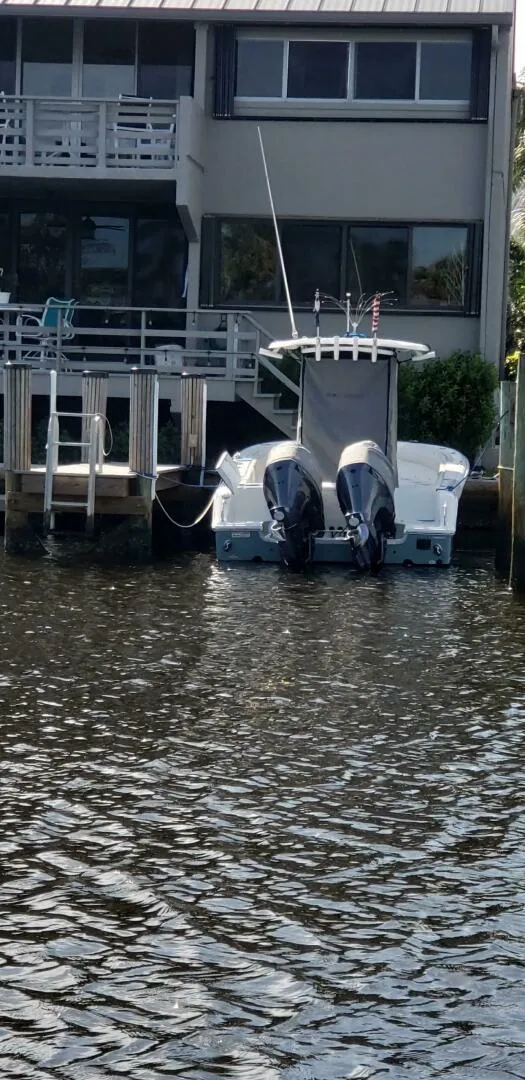 Slide: The Image of 2020 Sea Hunt Gamefish 25 docked near waterfront property. - 26