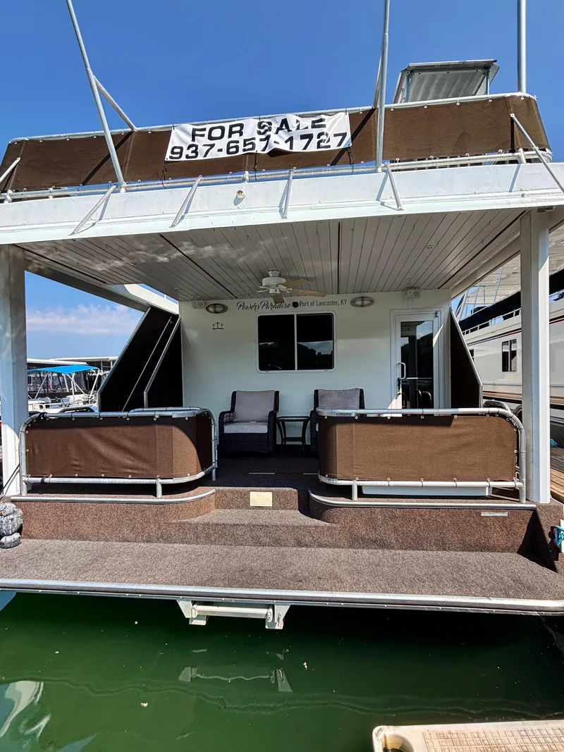 Slide: The Image of Houseboat for sale, Horizon 16x66, 2012 model, docked with seating area. - 10