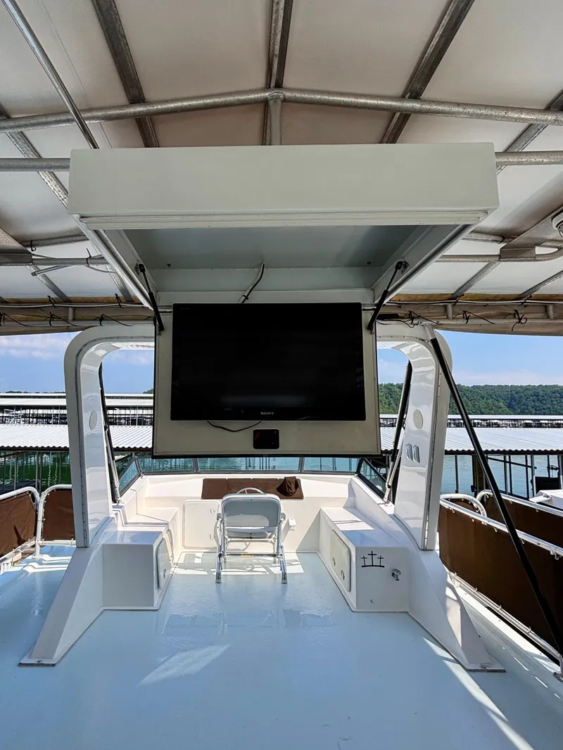 Slide: The Image of Upper deck of 2012 Horizon 16x66 houseboat with TV and seating area. - 11
