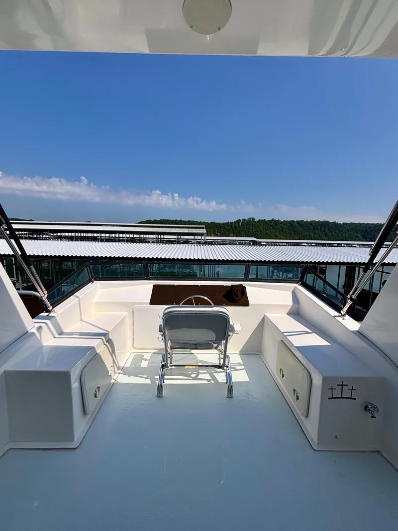 Slide: The Image of Upper deck of 2012 Horizon 16x66 yacht with seating, under clear blue sky. - 14