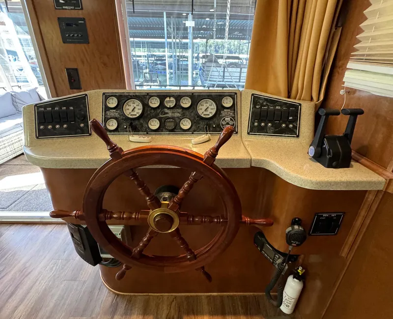 Slide: The Image of Wooden helm of 2012 Horizon 16x66 boat with gauges and controls. - 15