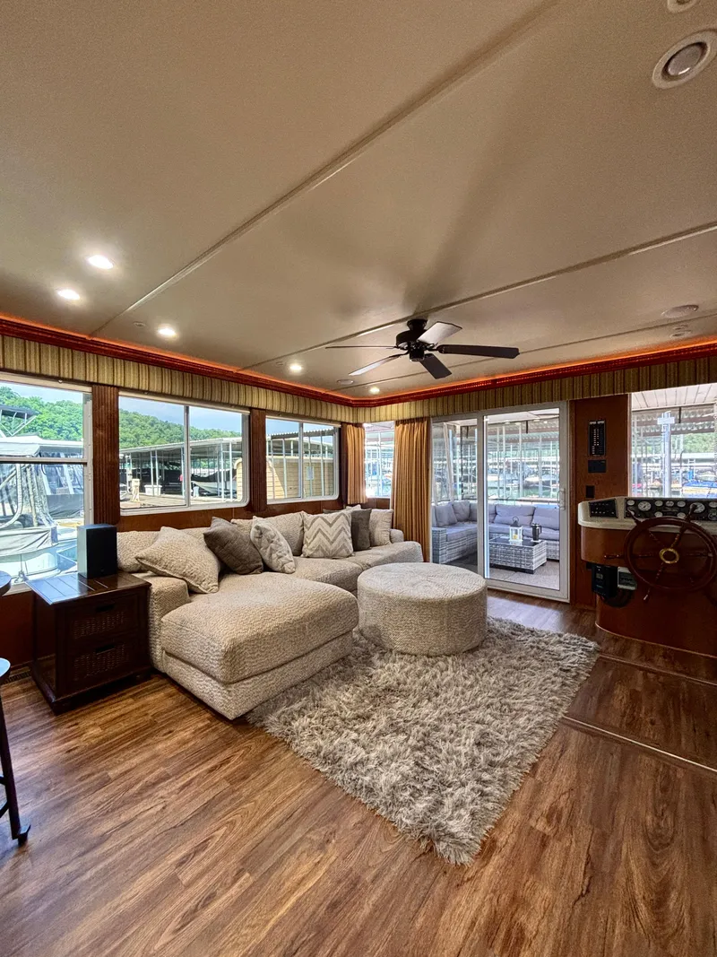 Slide: The Image of Luxurious 2012 Horizon 16x66 houseboat interior with plush seating and elegant decor. - 18