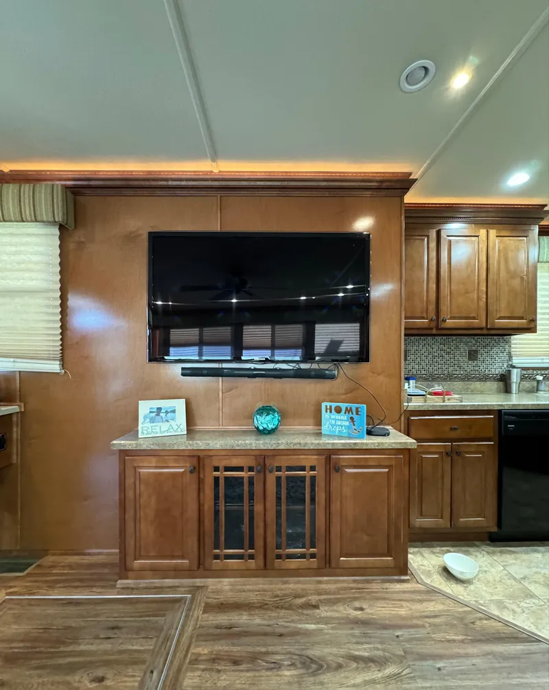 Slide: The Image of Luxurious 2012 Horizon 16x66 houseboat interior with modern kitchen and entertainment center. - 22