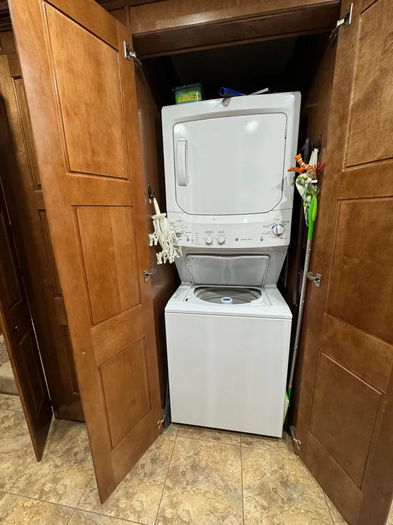 Slide: The Image of Stacked washer and dryer in wooden closet, Horizon 16x66 model, 2012. - 27