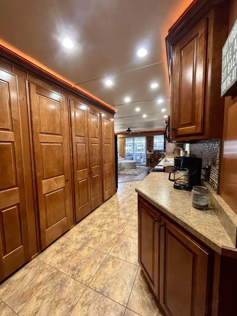 Slide: The Image of Luxurious kitchen interior of 2012 Horizon 16x66 with wooden cabinets and modern lighting. - 28