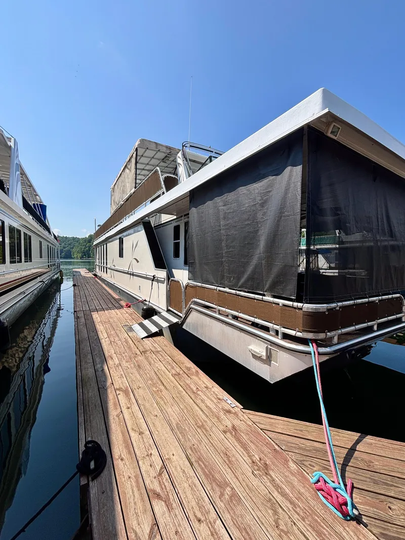 Slide: The Image of Houseboat docked on a sunny day, Horizon 16x66 model, 2012. - 3