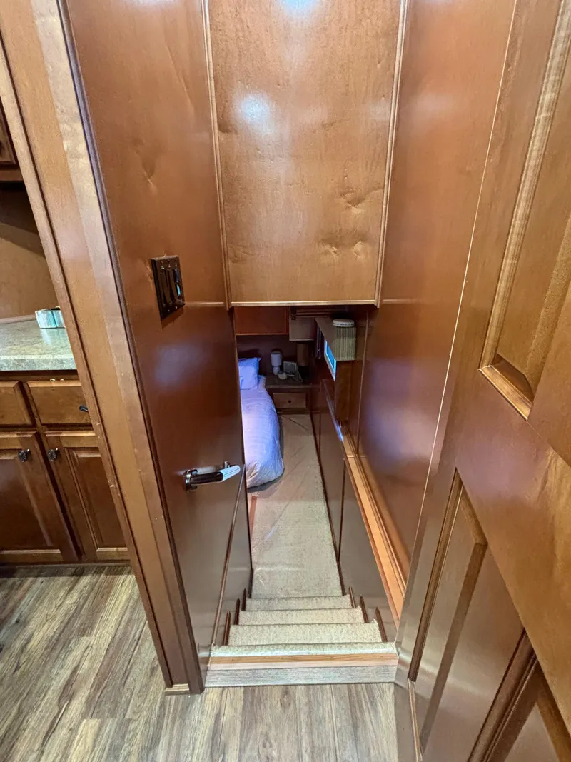 Slide: The Image of Staircase leading to a cozy bedroom in a 2012 Horizon 16x66 houseboat. - 31