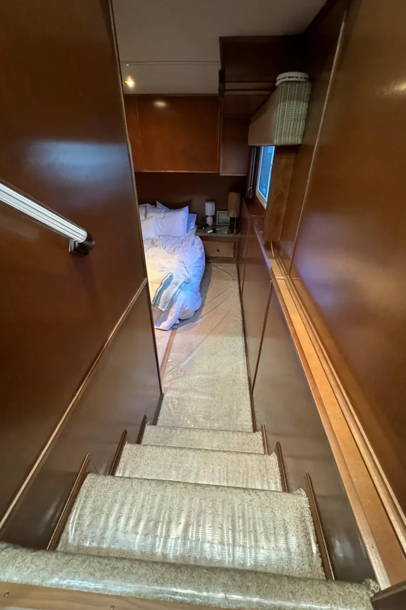 Slide: The Image of Staircase leading to cozy bedroom in 2012 Horizon 16x66 houseboat. - 32