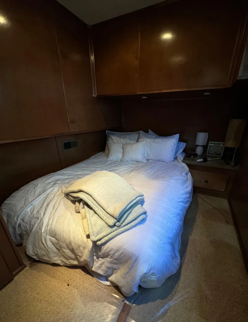 Slide: The Image of Cozy bedroom in 2012 Horizon 16x66 houseboat with wooden paneling and soft lighting. - 33