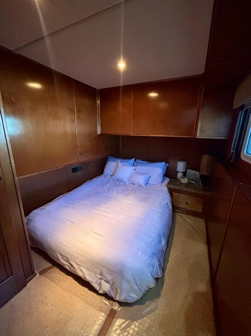 Slide: The Image of Cozy bedroom in 2012 Horizon 16x66 houseboat with wooden walls and soft lighting. - 34