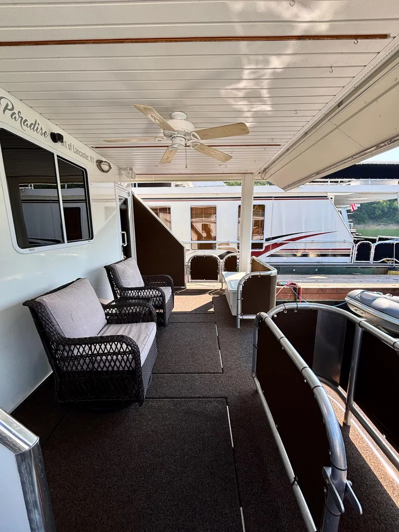Slide: The Image of Houseboat deck with wicker chairs, ceiling fan, and railing, Horizon 16x66, 2012 model. - 7