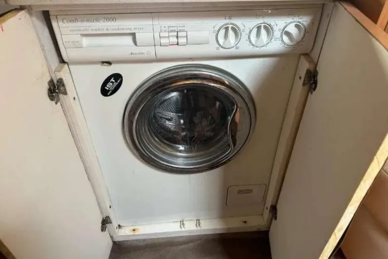 Slide: The Image of 2001 Regal Commodore 4160 washing machine in a cabinet, front view. - 2