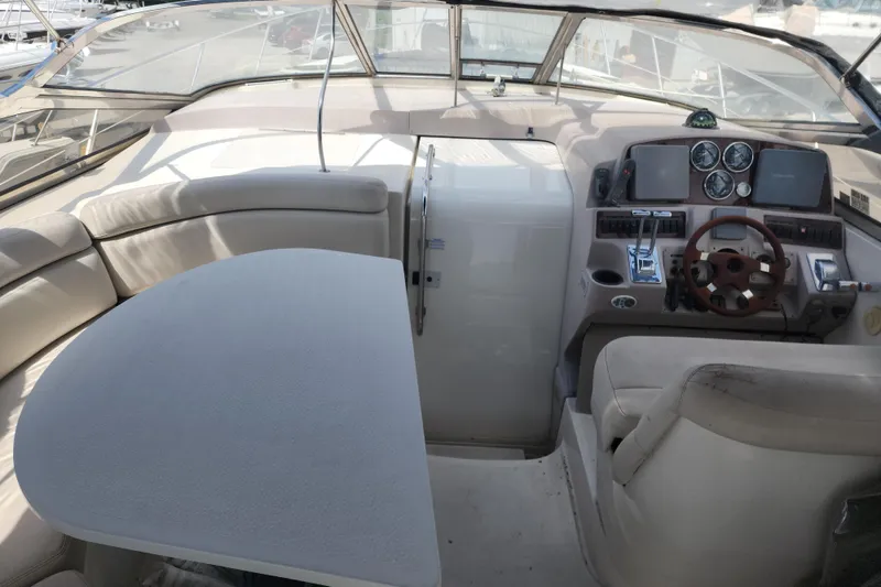 Slide: The Image of Interior of a 2001 Regal Commodore 4160 yacht with helm and seating area. - 3