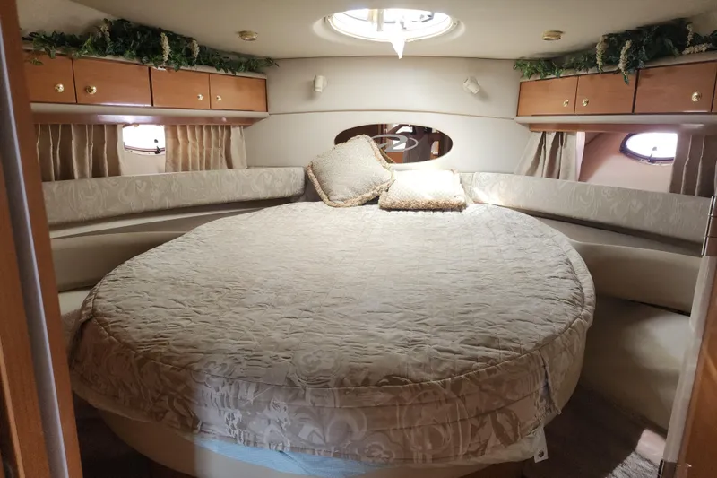 Slide: The Image of Luxurious cabin interior of 2001 Regal Commodore 4160 yacht with round bed and elegant decor. - 4