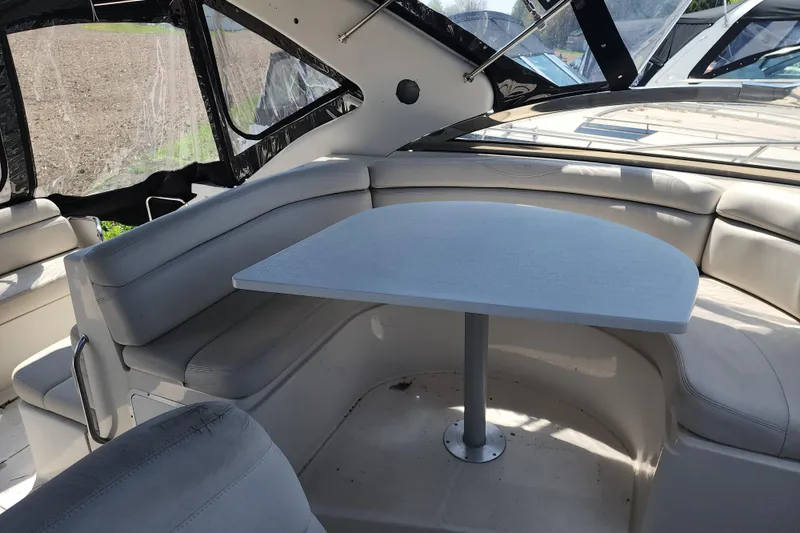 Slide: The Image of Interior of 2001 Regal Commodore 4160 boat with cushioned seating and table. - 7