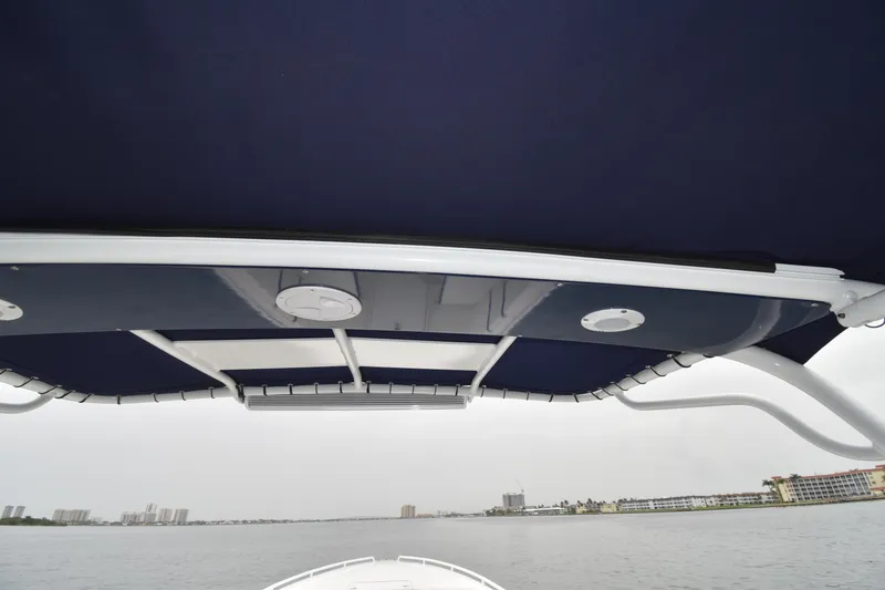 Slide: The Image of 1984 Chris-Craft Scorpion boat canopy with waterfront view. - 12