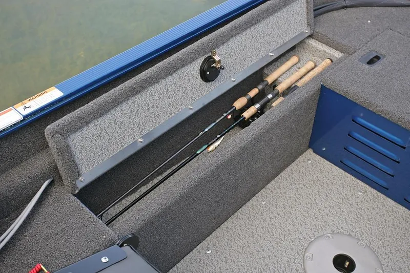 Slide: The Image of 2025 Lund 1650 Angler SS boat interior with two seats and steering console. - 7