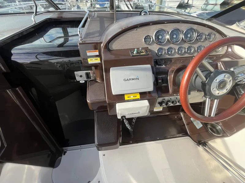 Slide: The Image of 2013 Regal 30 Express boat dashboard with Garmin navigation system. - 11
