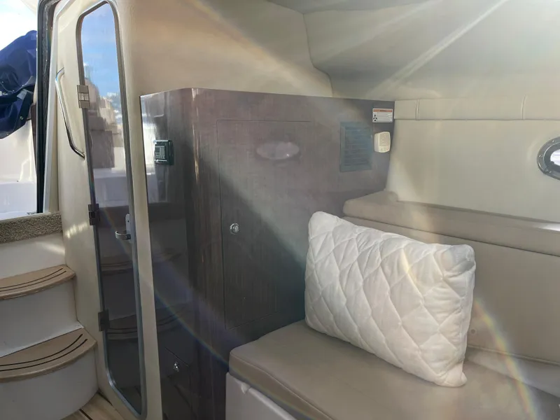 Slide: The Image of Interior of 2013 Regal 30 Express boat with seating and storage. - 17