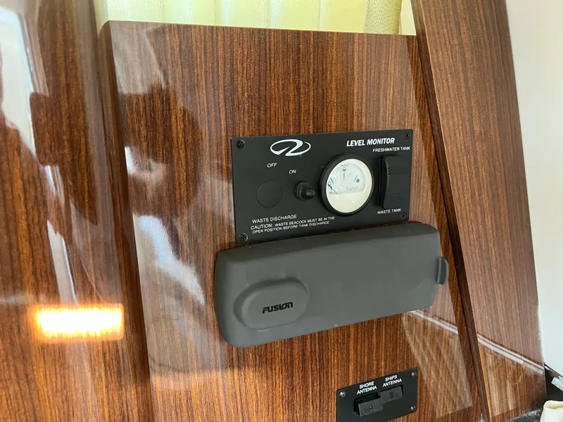 Slide: The Image of Level monitor panel on 2013 Regal 30 Express boat with wood finish. - 22