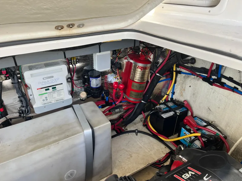 Slide: The Image of Engine compartment of 2013 Regal 30 Express boat with wiring and equipment. - 29