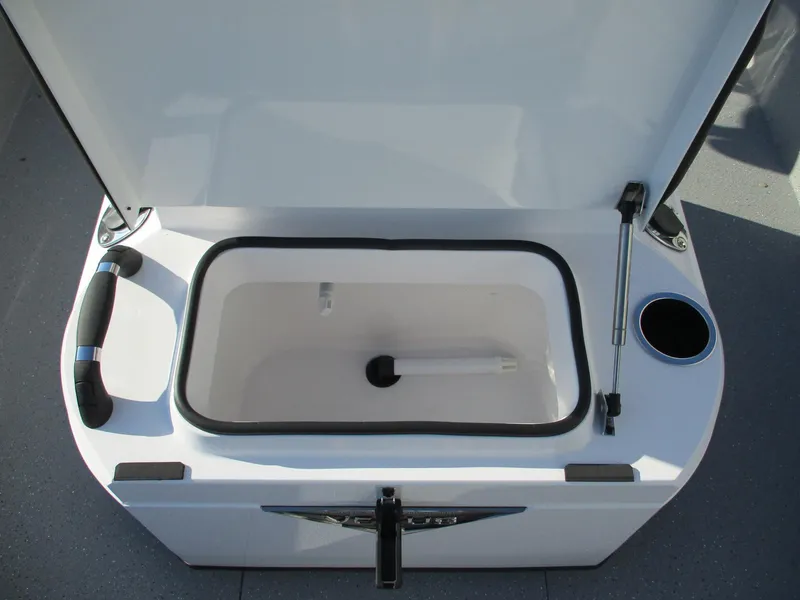 Slide: The Image of 2025 Vexus ACX 2150 boat storage compartment with open lid and cup holder. - 12