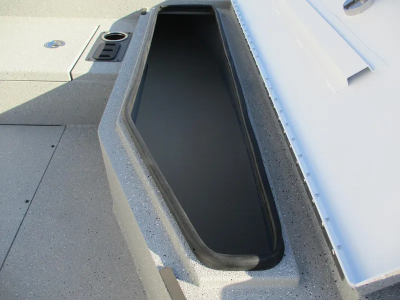 Slide: The Image of Vexus ACX 2150 boat storage compartment, 2025 model, with cup holder and textured surface. - 15