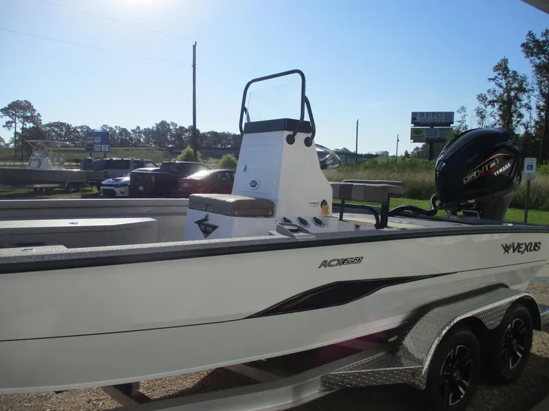 Slide: The Image of 2025 Vexus ACX 2150 boat on trailer in outdoor setting. - 2