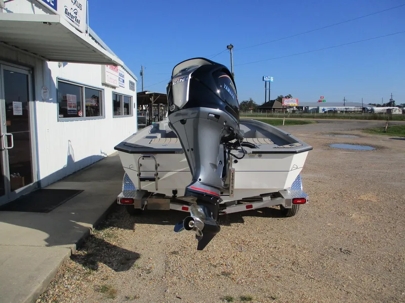 Slide: The Image of 2025 Vexus ACX 2150 boat on trailer outside dealership. - 5