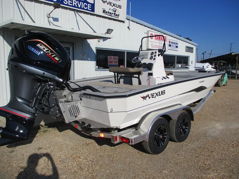Slide: The Image of 2025 Vexus ACX 2150 boat with Yamaha engine, parked outside dealership. - 6
