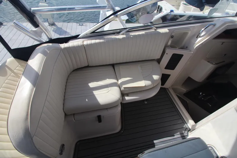 Slide: The Image of 2001 Grady-White Express 330 boat interior with white cushioned seating and sleek design. - 22